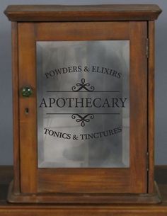 a wooden clock with the words apothecary on it's glass front