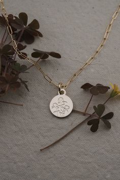 Places stay in our hearts whether we have grown up there or had a month that changed our lives. Keep those places and the people in them close with our Vermont state flower necklace. DETAILS: Red Clover artwork on the pendant 12mm round disc pendant Silver Jewelry: Silver plated pendant with Sterling Silver chain and findings. Gold Jewelry: Gold plated pendant with 14k gold filled chain and findings. All pieces were selected to be the best quality and value we could find for plated jewelry! Follow the care tips to make your plating last longer. Various chain options available in 17.75" and 19.75" lengths CARE TIPS: Avoid contact with perfumes, body oil, and other chemicals, including household cleaners. This will help the metal plating stay on! For light cleaning, polish with a lint free c Sterling Silver Birth Flower Jewelry For Anniversary, Birth Flower Pendant Jewelry For Memorial, 14k Gold Birth Flower Jewelry For Mom, 14k Gold Birth Flower Necklace For Mother's Day, Dainty Birth Flower Jewelry For Anniversary Gift, Memorial Birth Flower Jewelry, Gold Necklaces With Flower Charm For Anniversary, Flower Pendant Jewelry For Anniversary Gift, Gold Necklace With Flower Charm For Anniversary