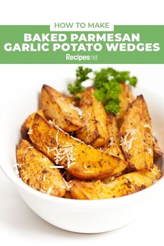 baked parmesan garlic potato wedges in a white bowl with parsley on top