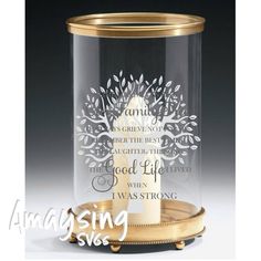 a glass jar with a gold rim and a tree on the bottom that says, i was strong