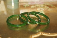 Beautiful, elegant and one of a kind Certified Natural Green Jade bracelet bangles to choose from. OFFERING 3 SIZES Here is a link to a youtube video that can help you determine the best size for your wrist. https://www.youtube.com/watch?v=QAEmQQCRzMc It is believed in Chinese tradition that Green Jade symbolized the five virtues of humanity, which are courage, modesty, justice, compassion, and wisdom. It's mainly considered as a symbol of serenity, tranquility, and purity. It's a stone that's b Handmade Green Jade Bangle, Handmade Elegant Jade Bangle, Jade Bracelet Bangles, Hamilton Jewelry, Green Jade Bracelet, Vinyl Display, Rose Gold Opal Ring, Butterfly Face, Blue Opal Ring