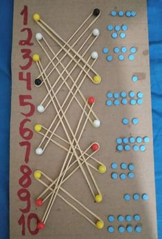 a cardboard board with matches and candy on it