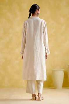 Beige linen tunic with khodi work on the collar and cuffs. Paired with a pant. - Aza Fashions Fitted Linen Straight Kurta Set, Elegant Linen Kurta For Spring, Spring Linen Straight Kurta Set, Traditional Linen Workwear Sets, Traditional Linen Sets For Workwear, Festive Long Sleeve Linen Sets, Linen Straight Kurta Set For Summer, Summer Linen Straight Kurta Set, Summer Linen Sets With Straight Kurta