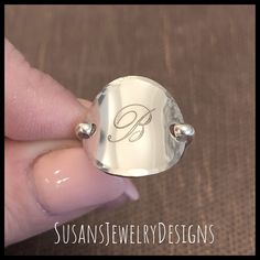 "This ring is made with a 3/4\" disc engraved with a beautiful script single initial in the center. Disc has been shaped to resemble a saddle style ring and will be made to your custom size preference. Wire has been added to make up the band of the ring and the edge of disc has been hammered to add a neat texture. This ring is super comfortable to wear. I can make this ring in rose gold filled, sterling silver (shown), or yellow gold filled. Use the options pull down menu to select your ring siz Saddle Ring, Letter Jewelry, Engraved Initials, Script Lettering, Initial Jewelry, Rose Gold Jewelry, Hammered Silver, Ring Sterling Silver, Custom Rings