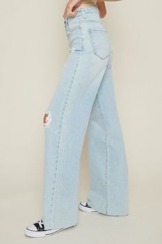 A pair of high-rise wide-fit jeans featuring classic 5-pocket construction, small distressed details, raw edge hem, and a zip-fly closure. - Rise: 12.25", Inseam: 33" - Model is 5'4" and wearing a size 3 - Ture to size Distressed Wide Leg Jeans, Character Making, Slouchy Jeans, Dog Boutique, Summer Denim, Mad Dog, Wide Jeans, Perfect Jeans, Jeans Online