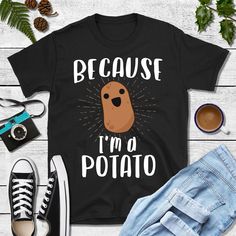 "Our 'Because I'm A Potato' Shirt comes in multiple styles. Perfect gift idea for a vegan, vegetarian, carb lover, or potato addict! Great for Mom, Dad, kids, and especially boys and girls on a birthday, Thanksgiving, or Christmas! ABOUT THIS PRODUCT: * Most fabrics are soft 100% ringspun cotton. Heather colors are a super soft polyester blend. * Need it fast? Choose Express shipping at checkout. * Need it by a certain date? Contact us! * We do personalization! If you need design text or colors Novelty Short Sleeve Shirt With Graphic Print, Fun Short Sleeve Shirt For Gift, Fun Black Shirt As Gift, Fun Black Shirt As A Gift, Novelty Black Short Sleeve Shirt, Novelty Cotton Shirt Pre-shrunk, Novelty Cotton Tops With Funny Text, Novelty Black Tops With Funny Text, Funny Print Shirt With Relaxed Fit As Gift