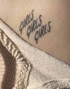 there is a small tattoo on the back of a woman's arm that says girls girls