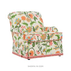 an upholstered chair with colorful flowers on it