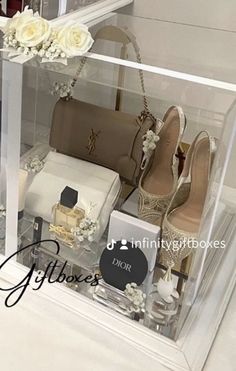 a display case filled with lots of different types of women's shoes and purses