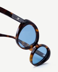 The FRANCES is 1970s beach fashion that achieves a summer look all year long. The tortoise frames are marked with attitude and colored lenses for those who both look and walk the part. Summer Tortoiseshell Sunglasses With Uva Protection, Tortoiseshell Sunglasses With Uva Protection For Summer, Summer Tortoiseshell Sunglasses With Gradient Lenses, Summer Beach Tortoiseshell Cat Eye Sunglasses, Vintage Blue Sunglasses For Summer, Blue Vintage Sunglasses For Summer, Retro Tortoiseshell Polarized Sunglasses, Retro Blue Sunglasses With Gradient Lenses, Retro Blue Cat Eye Sunglasses