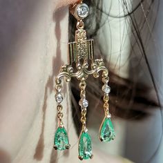 Earrings Size: 55 mm Metal Type: 14k Gold   Weight: 6.1 grams Diamonds: 0.35 ct. Cut: old European cut, single cut (8/8) Color: J-K Clarity: Si Natural Colombian Emerald: 3.20 ct. Condition: Excellent Art Deco emerald and diamond earrings from the 1920s. Featuring Mediterranean natural 3.2 ct. Colombian emeralds with a stunning green color and wonderful clarity and the altogether 0.35 ct. single cut and old European cut diamonds with J-K color and Si clarity. The earrings weigh 6.1 grams and are Classic Chandelier Dangle Earrings With 17 Jewels, Classic Yellow Gold Chandelier Earrings, Yellow Gold Chandelier Earrings For Anniversary, Classic Chandelier Earrings For Anniversary, Emerald Gold Earrings, Emerald And Diamond Earrings, Art Deco Emerald, Colombian Emeralds, European Cut Diamonds