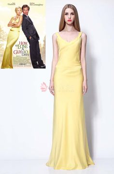 a woman in a yellow dress standing next to a movie poster