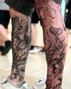 a person with tattoos on their legs and feet