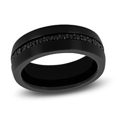 a black wedding band with diamonds on it