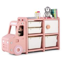 a pink toy truck with two white baskets and a stuffed animal