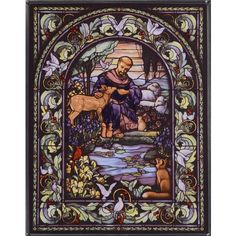 a stained glass window with an image of jesus and animals