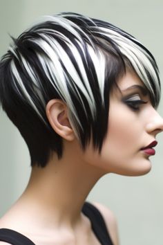 The black and white zebra-striped pixie is a choice for those with a fearless spirit. The zebra stripes bring a touch to your dark hair giving it a unique flair. Click here to check out more gorgeous short dark hair color ideas. Black And White Hairstyles Short, Black And Grey Hair Short, Platinum Highlights On Black Hair, Black And Blonde Hair Color, Black And White Hairstyles, Black And White Short Hair, Unique Hair Color Ideas, Hairstyle Color Ideas, Black And Silver Hair