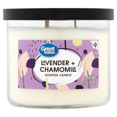 a candle with lavender and chamomi on it