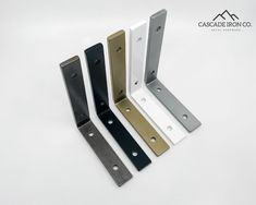 four different types of door handles on a white surface with the logo cascade iron co