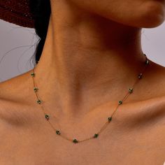 Elevate your jewelry collection with our exquisite Dual-Color 18K Gold-Plated Crystal Bead Necklace. This elegant piece features a stunning combination of vibrant emerald and deep black crystals, interspersed with gleaming gold beads. Choose between the lush greens of emerald or the bold allure of black for a versatile accessory that adds a touch of luxury to any look. Key Features: - 18K Gold Plating: Each necklace is meticulously plated with 18K gold for a rich, long-lasting shine. - Premium Crystals: Hand-selected emerald and black crystals ensure maximum sparkle and clarity. - Interspersed Design: Gold beads are strategically placed between crystal beads for a visually striking effect. - Versatile Choice: Perfect for both formal events and everyday wear, this necklace is a timeless add Gold Beaded Emerald Necklace, Elegant Emerald Necklace With Beaded Chain, Green Beaded Clavicle Chain Necklace For Gift, Gold Emerald Bead Necklaces, Gold Emerald Round Bead Necklaces, Dainty Green Jewelry With Colorful Beads, Gold Emerald Necklace With Polished Beads As Gift, Green Emerald Beaded Necklaces For May Birthstone, Dainty Green Necklace With Round Beads