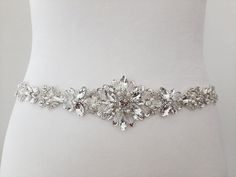 "Silver Wedding Belt, Bridal Belt, Crystal Belt for Wedding Dress, Wedding Sash, Wedding Dress Belt, Rhinestone Belt, Evening Prom Belt Made with love in our studio in California <3 This gorgeous wedding belt will be an amazing complement  for your dress! The ribbon is double side faced silky satin or organza ribbon of high textile quality. It is pleasant to eye and soft to touch. The color is wholesome and saturated. The jewel part includes rhinestones, crystals of different sizes. The combinat Wedding Dress With Belt, Belt For Wedding Dress, Bride Belt, Belt Wedding Dress, Rhinestone Belts, Nye Wedding, Wedding Belt, Wedding Dress Belt, Crystal Belt