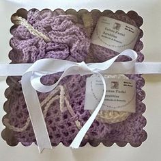 Crochet Lilac   Spa Set. These are new and Handmade  This 9 piece spa set is Lilac  trimmed in White  color. All is made of 100 % Cotton yarn. The gift set comes with a:  Facial Cloth which is 9x9 Facial Scrubbies -6 - 3 of Lilac and 3  White   and  are 3 inch round Soap Saver is 6x5 Shower Puff or called Bath Pouf The white gift box is 10x10  The gifts set comes in a white gift box tied with a white ribbon that is already to gift to that special person. This is a crochet spa set that can be use Crochet Spa Set, Crochet Lilac, Soap Saver Bag, Facial Cloths, Bath Kit, Shower Puff, Gifts Set, Spa Set, Soap Saver