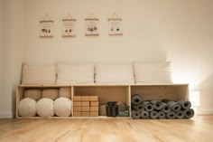 a room with wooden floors and white walls