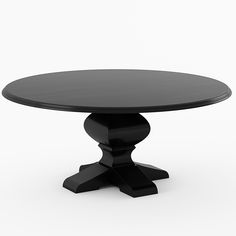 a black round table sitting on top of a white floor