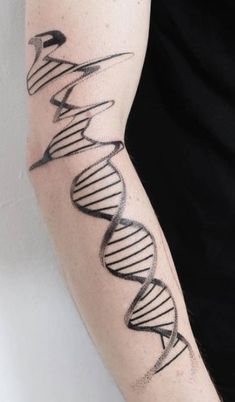 a man with a tattoo on his arm that has a double strand of medical symbols