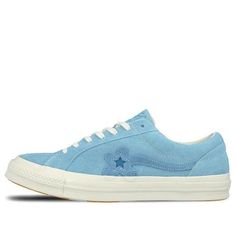 The Converse X Golf Le Fleur One Star is a sneaker that combines premium style with unbeatable comfort. The Bachelor Blue suede upper is accented with white contrast stitching and a floral One Star logo, while the cream vulcanized midsole ensures a cushioned ride. The orange rubber outsole provides grippy traction and completes the look. Whether you're hitting the streets or the golf course, this shoe has you covered in style. Blue High-top Sneakers With Stitched Sole, Blue Suede Sneakers For Streetwear, Blue Suede Sneakers With Vulcanized Sole, White Low-top Sneakers With Contrast Stitching, Blue Suede Low-top Skate Shoes, Leather High-top Sneakers With Contrast Stitching, Lace-up Sneakers With Contrast Stitching For Streetwear, Low-top Sneakers With Contrast Stitching For Streetwear, Low-top Leather Sneakers With Contrast Stitching