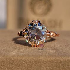 a diamond ring sitting on top of a table