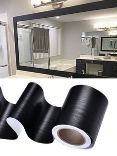 three rolls of black duct tape next to a bathroom mirror