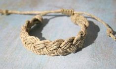 a close up of a rope bracelet on a table