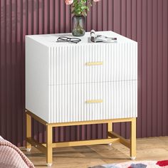 PRICES MAY VARY. 🌟2 Streaked Drawer: Wooden countertop is for displaying lamps, clocks, books, eyeglasses, and more — With a striped texture and golden handle, the modern white nightstand can be pulled out easily for concealing clutter, accessories, gadgets, etc 🌟Good Dream Tonight: The lamp on the white and gold nightstand is on, your favorite novels lying on the open shelf, and your cozy pajamas and eye masks in the drawers; with everything under your control, this nightstand is a great piece in any home's decor, complementing most furnitures whether traditional, rustic, or modern. 🌟White Nightstand, Shining Everywhere: More than a nightstands bedroom but a bedside storage night stand, 2 drawer white gold nightstand, sofa end tables, office supply storage, kids nightstand for bedroom, White And Gold Nightstand, Nightstands Bedroom, Bedroom Organizer, Gold Nightstand, Metal Nightstand, Bed Side Table, Bedroom Essentials, Modern End Tables, Sofa End Tables