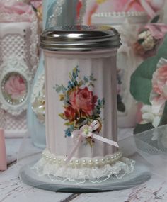 there is a small jar with flowers on it