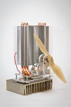 a fan that is attached to the back of a machine with copper foil on it