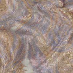 an abstract pattern with gold and purple colors on a gray background that looks like marble