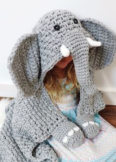 A cute blanket to crochet with attached mittens. Kit includes Softee Chunky and Mary Maxim Starlette yarns to make child's size. Bonus patterns to make baby & adult sizes too! Moss Stitch Pattern, Crochet Elephant Pattern, Elephant Blanket, Ornaments Crochet, Mary Maxim, Confection Au Crochet, Crochet Elephant, Hand Crochet Baby Blanket, Blanket Patterns