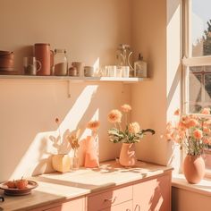 the sun shines on some flowers in vases and other items sitting on a window sill