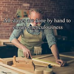 a man in an apron is working on some wooden pieces with the words, all stages are done by hand to ensure metalluousness