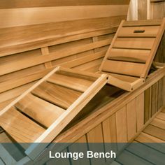 a wooden bench sitting inside of a sauna with the words lounge bench above it