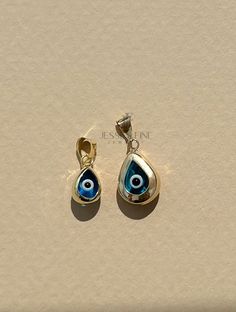 This evil eye teardrop pendant is 14k gold. This is real gold not plated This ocean blue evil eye teardrop pendant is sure to ward off any evil This teardrop evil eye pendant makes the perfect gift and comes packaged ready to be gifted This teardrop pendant is perfect to be worn alone or can be layered with our bestselling cornicello pendant and manu cortuno pendant Measurements: Larger teardrop pendant weights 0.63 and approximately 11 mm in height ,8 mm width and about 3 mm thickness ( measure Sterling Silver Evil Eye Teardrop Jewelry, Sterling Silver Teardrop Evil Eye Jewelry, Blue Teardrop Gold Plated Jewelry, Blue 14k Gold Drop Jewelry, Blue Teardrop Spiritual Jewelry, Evil Eye Amulet, Glass Evil Eye, Evil Eye Protection, Blue Evil Eye