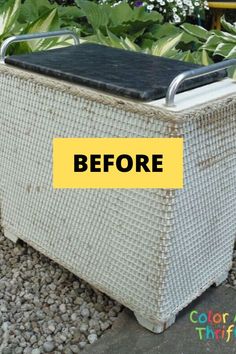 a white wicker basket with a black top and yellow sticker on the side