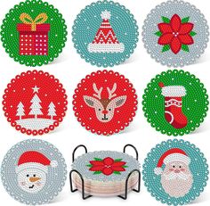 cross stitch christmas coasters with santa's hats and gifts