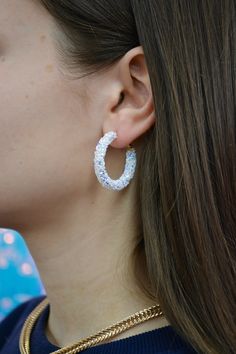 We will take any excuse to add a color accent into our wardrobe. These Glitter Hoops are sparkly AND colorful… so basically the perfect combo. Add these earrings to your outfit for a fun pop of color. gold plated nickel free latch back style glitter Trendy Sparkling Hoop Earrings For Party, Glitter Party Jewelry, Trendy Silver Glitter Earrings, White Small Hoop Jewelry For Party, White Sparkling Hoop Earrings As Gift, White Sparkling Hoop Earrings For Gift, Sparkling White Hoop Earrings As Gift, Trendy Sparkling Stones Hoop Earrings For Party, Trendy Hoop Earrings With Sparkling Stones For Party