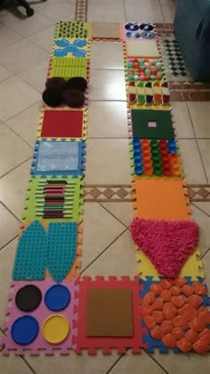 the floor is made out of legos and has different colored blocks on it, including one