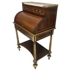 an antique writing desk with brass trimmings and drawers on casteors, from the early 19th century