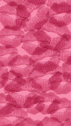 pink lipstick kisses on a pink background