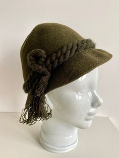 "Vintage knitted hat in moss green colour Estimated Size: small Inside circumference - 21.5\"/ 54.5 cm Please check measurements to insure a proper fit. Remember to allow yourself some extra room for movement. You can compare these with something from your closet that fits you well. This hat will come to you freshly laundered and ready to wear. Please feel free contact me if you need additional measurements or have any questions Condition: very good vintage condition SHIPPING * I ship worldwide Adjustable Green Winter Hats, Green Wide Brim Mini Hat For Winter, Green Cloche Hat For Winter, Winter Wool Mini Hat With Curved Brim, Winter Wool Mini Hats With Short Brim, Winter Mini Hats With Short Brim In Green, Green Mini Hat With Short Brim For Winter, Green Winter Mini Hats With Short Brim, Green Mini Hats With Short Brim For Winter