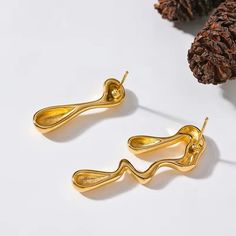 Minimalist Creative Metal Irregular Water Drop Earrings – Gold Plated Asymmetric Jewelry for Women Step up your style with our Minimalist Creative Metal Irregular Water Drop Earrings. These gold-plated stainless steel earrings feature a glossy, asymmetric design, perfect for women who appreciate trendy and aesthetic accessories. The irregular water drop shape adds a touch of creative flair, making these earrings a standout addition to any outfit. Crafted with high-quality materials, these earrin Gold Irregular Minimalist Jewelry, Gold Minimalist Jewelry With Irregular Shape, Minimalist Irregular Metal Jewelry, Water Drop Earrings, Aesthetic Accessories, Festival Chic, Drop Earrings Gold, Straw Bags, Steel Earrings